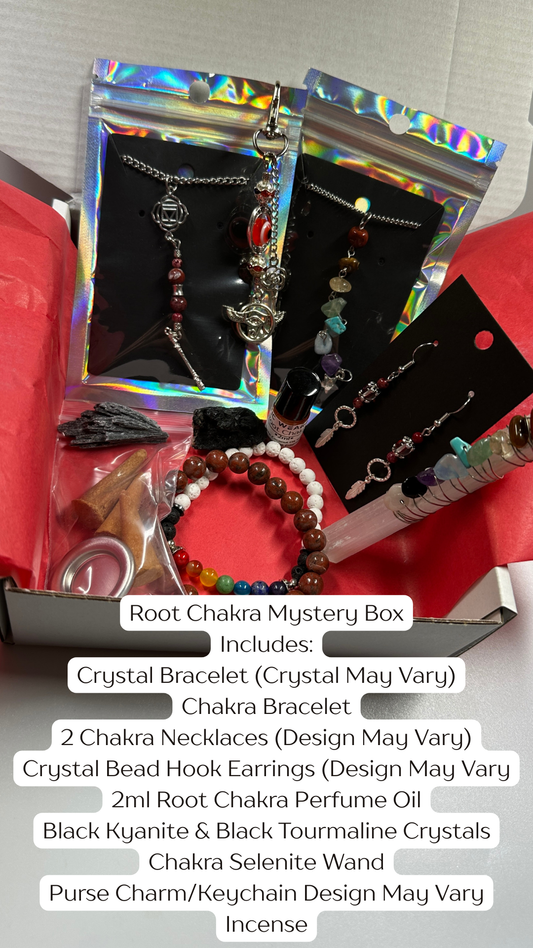Root Chakra Mystery Box contents on a red surface with text overlay.